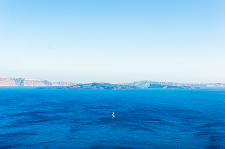 body of water near mountain thumbnail