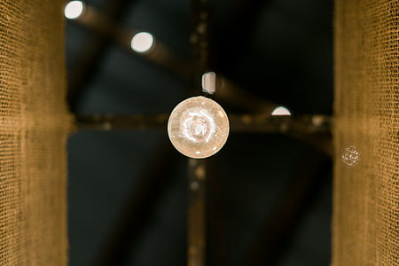 close-up photo of round silver-colored coin on clear glass surface thumbnail