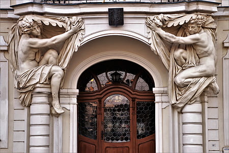 architecture photography of statue pillars thumbnail