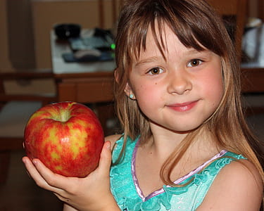 girl holding apple thumbnail