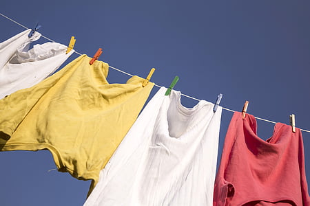 four clothes hanged on wire thumbnail