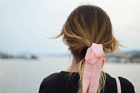 person wearing pink lace hair accessory thumbnail