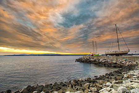 blue sea under orange sky thumbnail