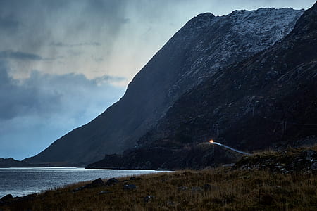 mountain beside body of water thumbnail