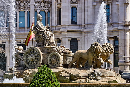 person riding carriage with two lions statue thumbnail