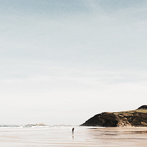 person standing on seashore thumbnail