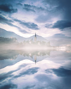 gray and white house covered with fogs thumbnail