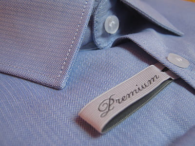 closeup photo of blue Premium button-up dress shirt thumbnail