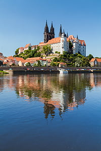 castle beside body of water thumbnail