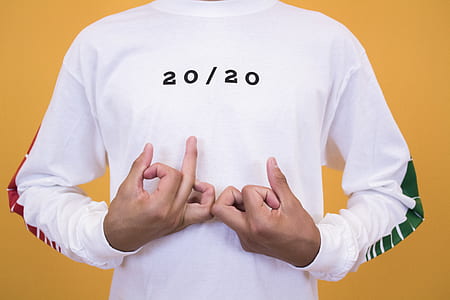 person in white sweatshirt showing blood hand sign thumbnail