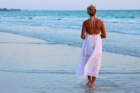woman in white halter dress on seashore thumbnail