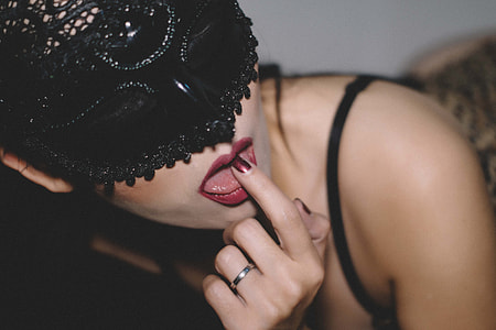 woman in black spaghetti strap with masquerrade mask thumbnail