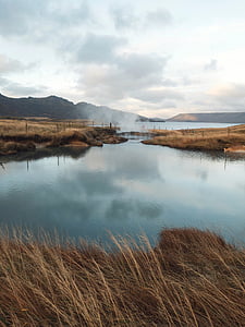 calm body of water near hot spring thumbnail