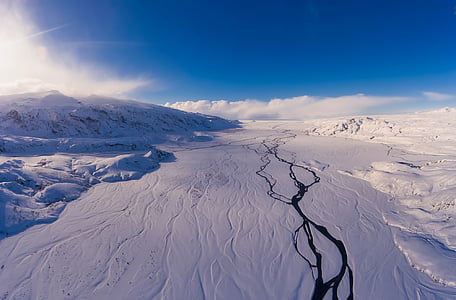 snow field under clear blue sky during daytime thumbnail