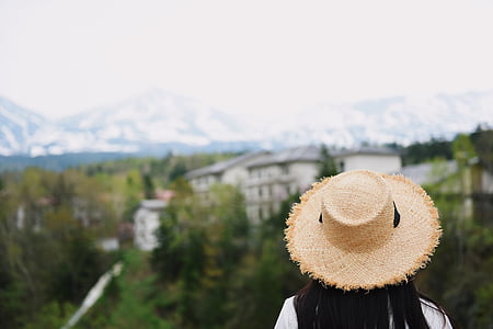 selective focus photo of woman wearing brown hat thumbnail
