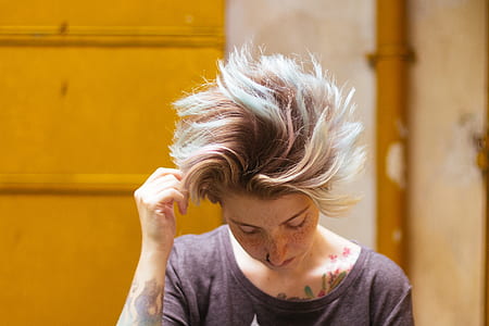 shallow focus photography of woman waving her hair thumbnail