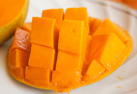 sliced of mango fruit on white surface thumbnail