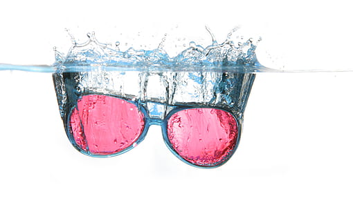 Black Framed Red Aviator Sunglasses on Water thumbnail