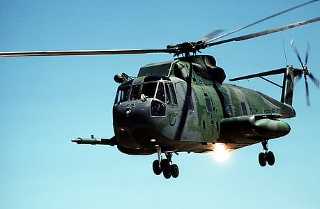low-angle photo of green helicopter thumbnail
