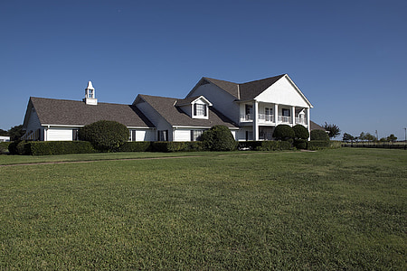 white and black 2-storey house near open field thumbnail