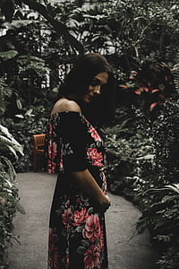 woman wearing dress beside green leafed tree thumbnail