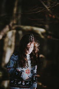 photo of woman wearing blue and black sweater thumbnail