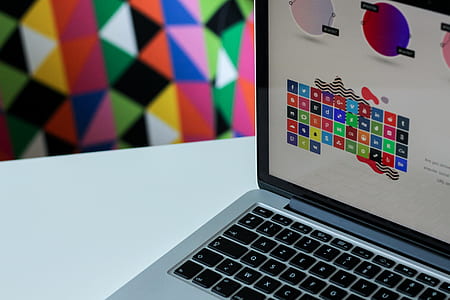 silver laptop computer on white surface thumbnail