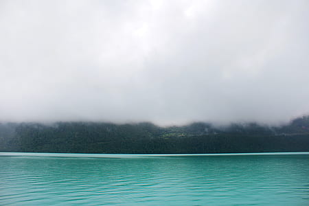 body of water along foggy island thumbnail