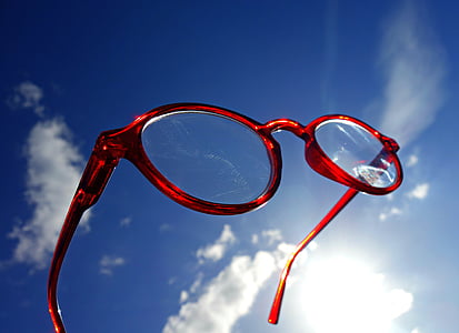 red framed eyeglasses under blue sky at daytime thumbnail