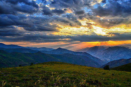 mountain range under gray clouds thumbnail