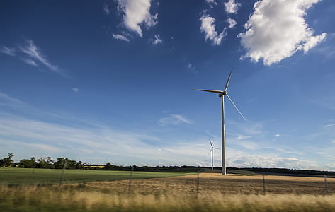 White Windmill Under Blue and White Sky at Daytime thumbnail