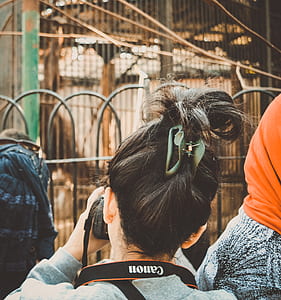 Woman Taking Photograph Using Canon Dslr Camera thumbnail