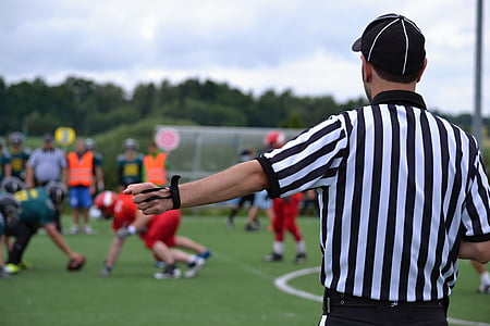 man standing on grass field thumbnail