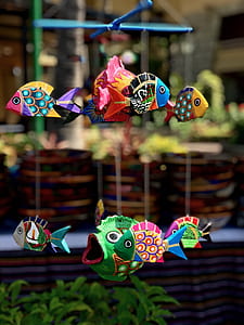 assorted-color fish floating decor at daytime thumbnail