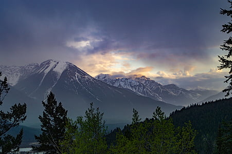 snow cap mountain near forest during daytime thumbnail