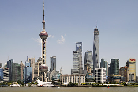 photography of city buildings under cloudy sky during daytime thumbnail