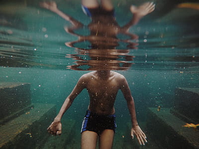 man swimming on pool thumbnail