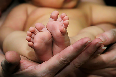 person carrying baby thumbnail