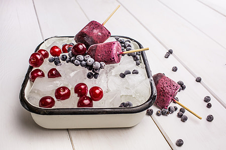 cherries and blueberries inside square white food container thumbnail