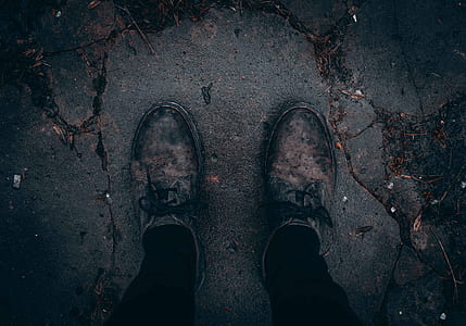 person wearing black bottoms and pair of gray shoes thumbnail