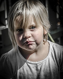 low-light photo of girl wearing white shirt thumbnail