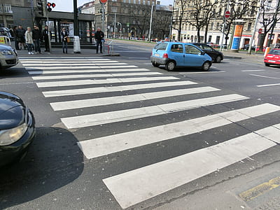 vehicles near building at daytime thumbnail