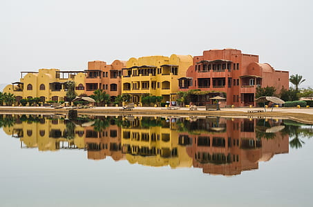 concrete buildings near body of water thumbnail