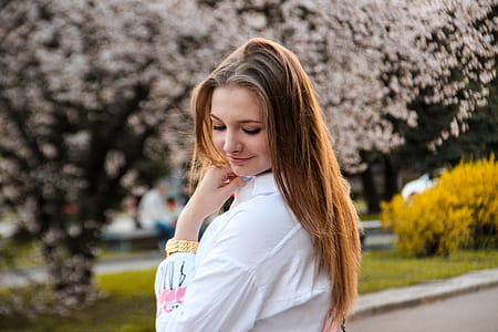 selective focus photography of woman looking to the left while smiling thumbnail