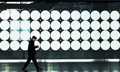 man walking beside LED lights thumbnail