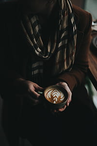 person holding black ceramic cup thumbnail