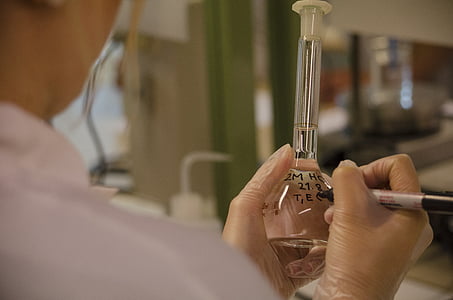 person writing on glass tube thumbnail