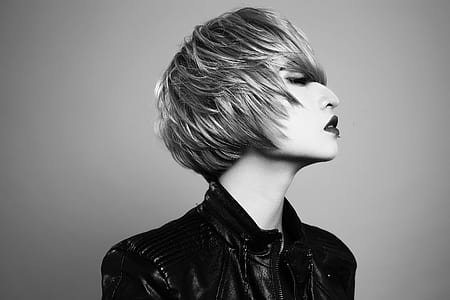 woman wearing jacket near wall thumbnail