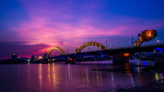 silhouette of dragon bridge at nighttime thumbnail
