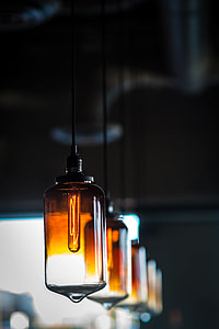 selective focus photography of hanged amber glass lamps thumbnail